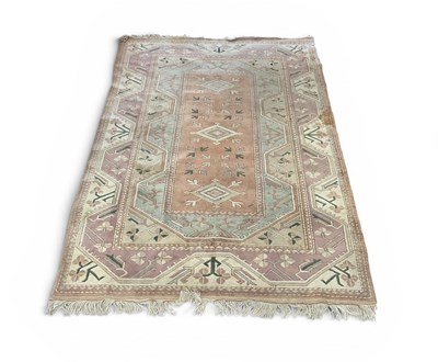 Lot 2166 - A beige ground Turkish hand knotted woolen rug...