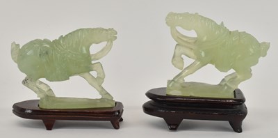 Lot 1028 - A modern Chinese carved green jade figure of a...