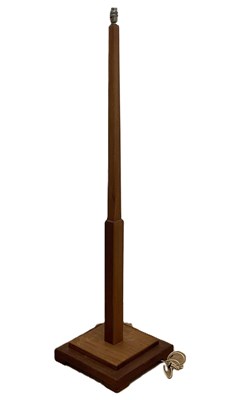 Lot 637 - An Art Deco style teak floor lamp with stepped...