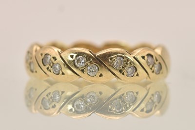 Lot 1344 - A 9ct yellow gold tiny diamond set band ring...