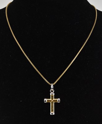 Lot 1367 - An 18K two-tone gold cross, the yellow gold...