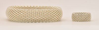 Lot 1229 - TIFFANY & CO; a modern woven silver bracelet...