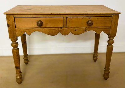 Lot 854 - A Victorian pine writing table with turned...