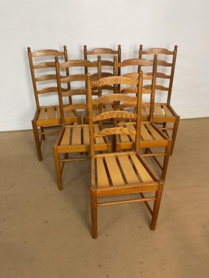 Lot 877 - ERCOL; a set of six pine ladder back dining...