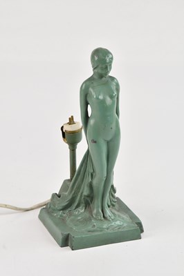 Lot 2355 - An Art Deco green painted metal figural table...