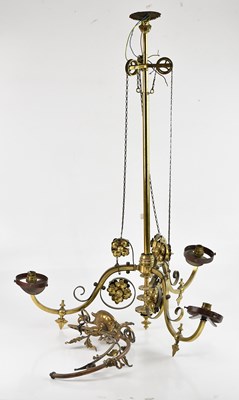 Lot 2346 - An Arts and Crafts cast brass three branch...