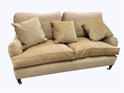 Lot 1022 - GEORGE SMITH; a modern two seater sofa, golden...