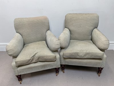 Lot 1037 - A pair of modern wing back chairs, with...