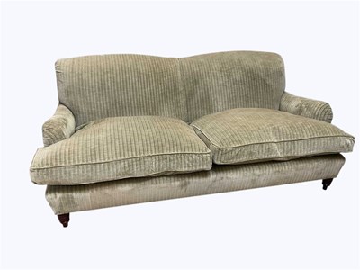 Lot 1023 - A modern two seater settee, with olive green...