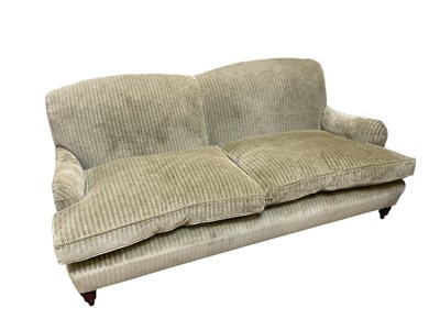 Lot 1024 - A modern two seater settee, with olive green...