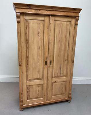 Lot 54 - A Continental pine armoire, height 202cm,...