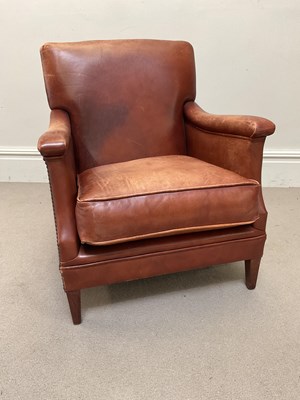 Lot 1118 - A modern tan leather library chair, on tapered...