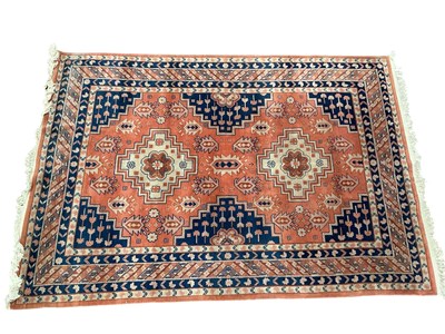Lot 2171 - An orange ground Eastern style hand knotted...
