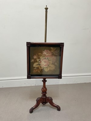 Lot 249 - A Victorian pole screen with brass column...