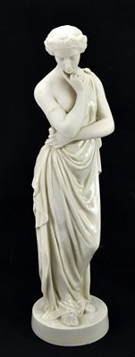 Lot 1303 - BELLEEK; a porcelain figure of a maiden,...