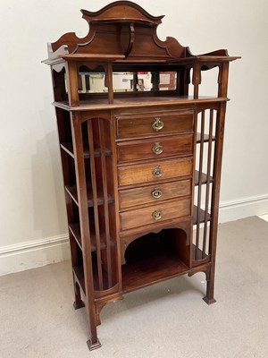 Lot 161 - An Arts and Crafts mahogany music cabinet with...