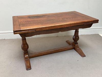 Lot 67 - A reproduction oak draw-leaf table, height...