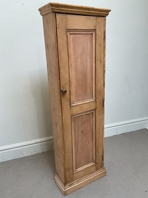 Lot 65 - A pine cupboard with single door, height 179cm,...