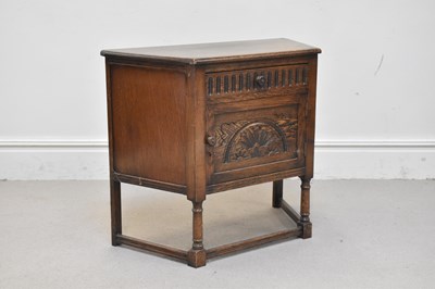 Lot 1123 - A reproduction oak hall cupboard