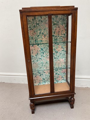 Lot 255 - An Art Deco style oak display cabinet with...