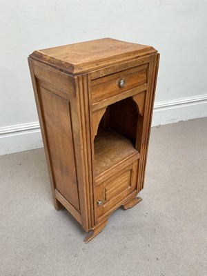 Lot 256 - A Continental oak side cabinet with single...