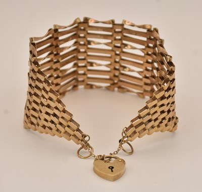Lot 1495 - A 9ct yellow gold gate link bracelet with...