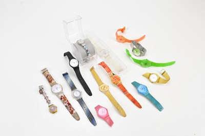 Lot 1239 - SWATCH; a collection of watches including...
