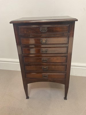 Lot 1307 - An Edwardian six drawer music cabinet, height...
