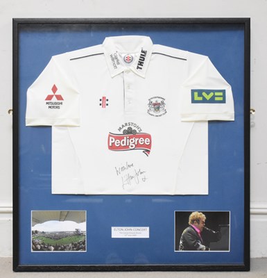Lot 693 - ELTON JOHN; a signed Gloucestershire County...