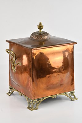 Lot 594 - An Arts and Crafts copper and brass log bin,...