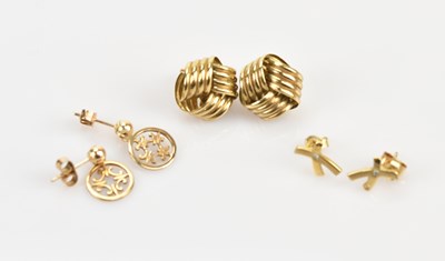 Lot 183 - Three pairs of yellow metal ear studs...