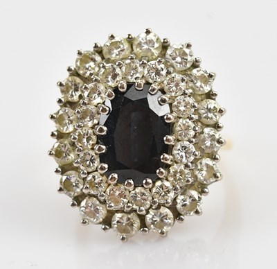Lot 381 - An 18ct yellow gold diamond and sapphire...