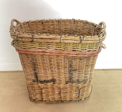 Lot 793 - An industrial wicker basket with wooden...