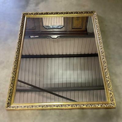Lot 692 - A decorative gilded baroque style wall mirror,...