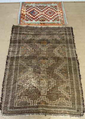 Lot 883 - A woollen woven Kilim rug, 91 x 67cm, together...