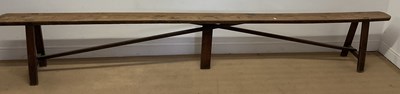 Lot 791 - An early 20th century pine wooden bench with...