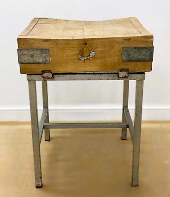 Lot 662 - A wooden butcher's block set within a...