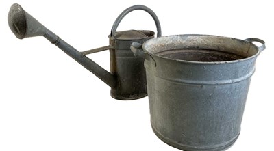 Lot 906 - A galvanised watering can and water container,...