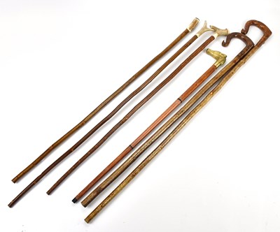 Lot 2089 - A group of six walking sticks including antler...