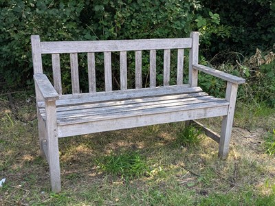 Lot 1429 - A vintage teak slatted garden bench.