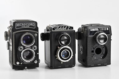 Lot 138 - Three medium format film cameras, comprising a...