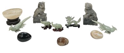 Lot 1034 - A pair of modern Chinese carved hardstone Dogs...