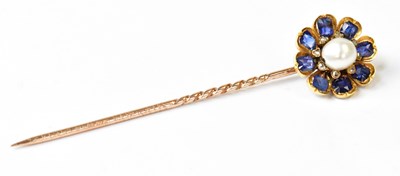 Lot 596 - A 19th century yellow metal stick pin set with...