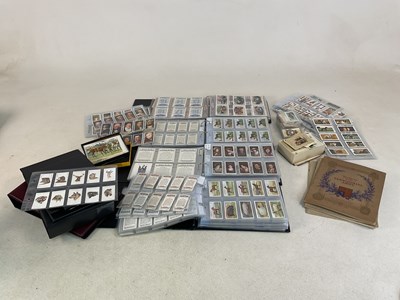 Lot 479 - Four modern cigarette albums containing a...