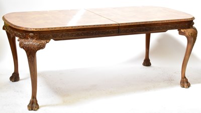 Lot 13 - A reproduction walnut dining suite, comprising...