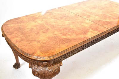 Lot 13 - A reproduction walnut dining suite, comprising...