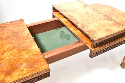 Lot 13 - A reproduction walnut dining suite, comprising...