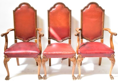 Lot 13 - A reproduction walnut dining suite, comprising...