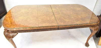 Lot 13 - A reproduction walnut dining suite, comprising...