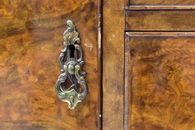 Lot 13 - A reproduction walnut dining suite, comprising...